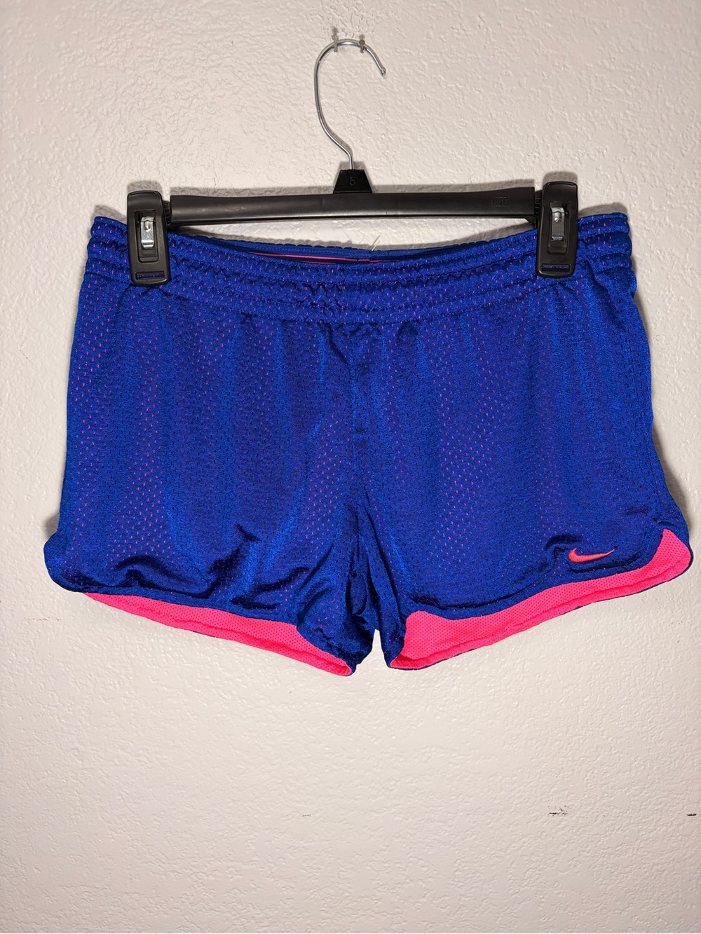 Nike Women's Blue Athletic Shorts with Pink Accent